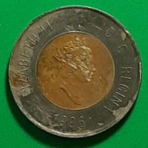 The obverse side of a 1996 Canadian 2-dollar coin, showing wear on it.